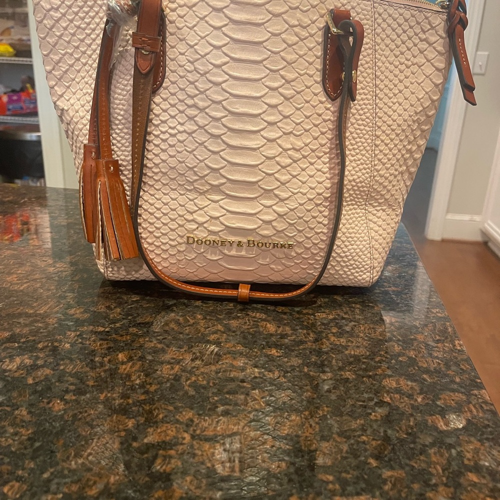 Dooney and bourke purse with matching wallet.